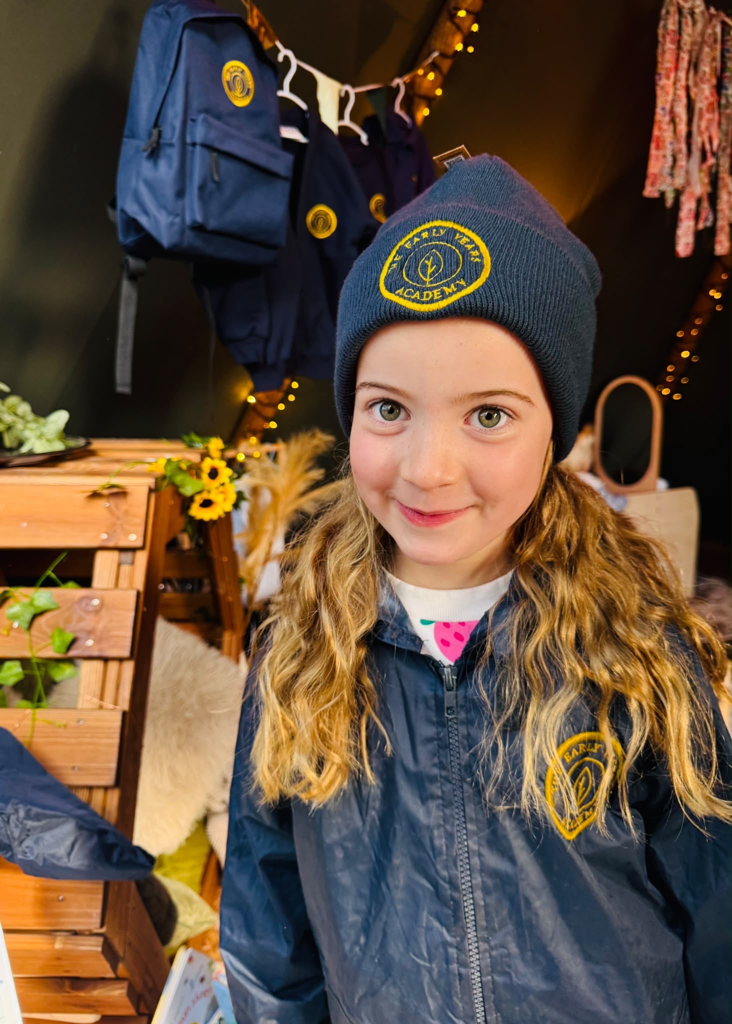 A young visitor wearing a uniform hat during the nursery’s open day